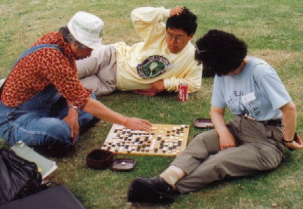 Oriental friends playing Go